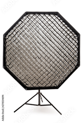 equipment flash with honeycombs with octagonal softbox on the rack in studio close-up on a white background photo