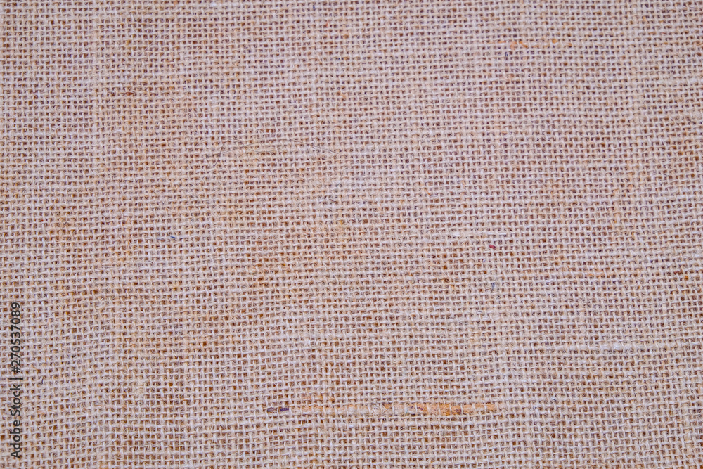 Hessian sackcloth burlap woven texture background / cotton woven fabric background with flecks of varying colors of beige and brown. with copy space. office desk concept. - obrazy, fototapety, plakaty 