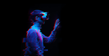 Man is using virtual reality headset. Image with glitch effect.
