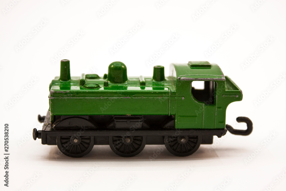 green toy locomotive on a white background green toy locomotive on a white background