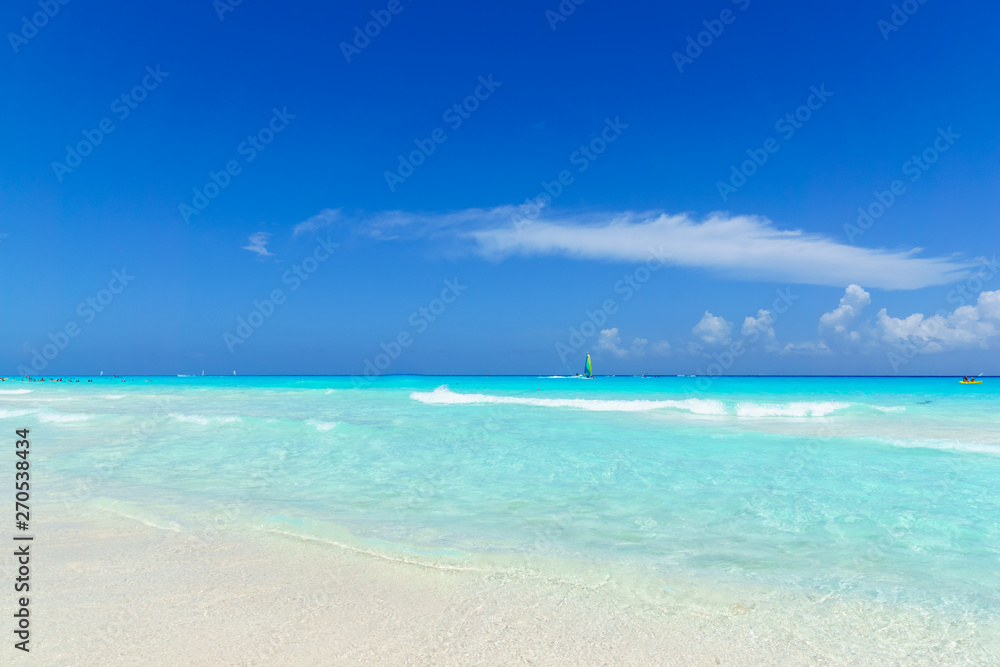 Beautiful gentle wave at tropical beach with clear sky