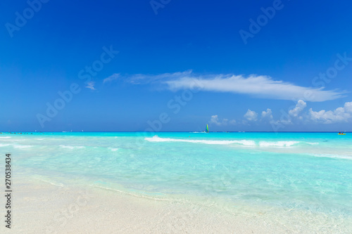Beautiful gentle wave at tropical beach with clear sky © htpix