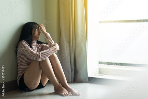 Asian woman feeling depression of lonely have a headache,Mental disorder health care,World suicide prevention day concept