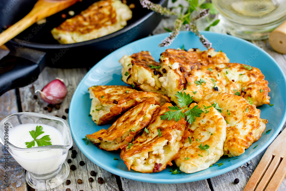 Pan fried zucchini pancakes stuffed with meat