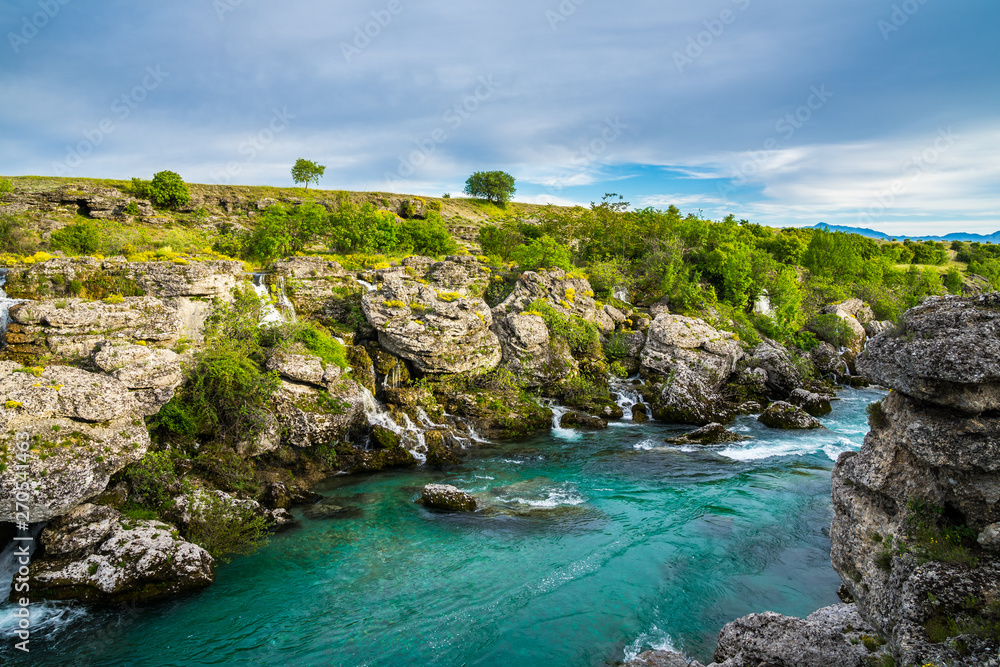 Montenegro, Turquoise clean clear river cijevna near podgorica at niagara falls flowing through beautiful green rocky nature landscape