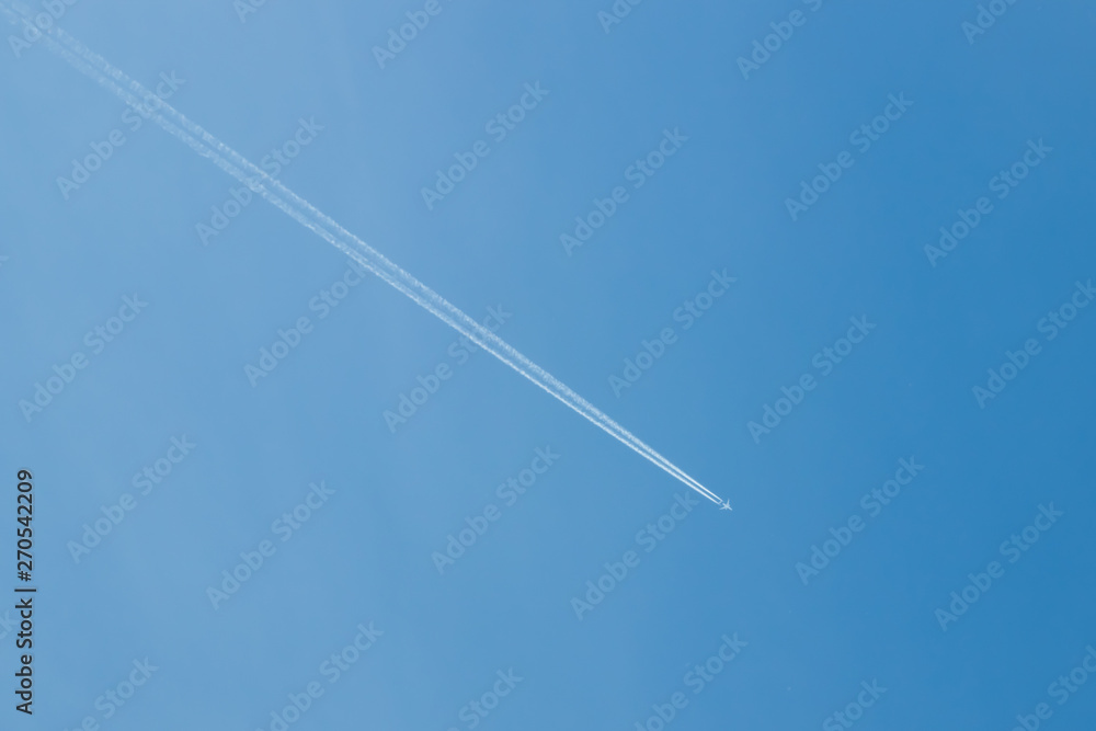 Trail of jet plane on clear blue sky. Trail of jet plane on clear blue sky.