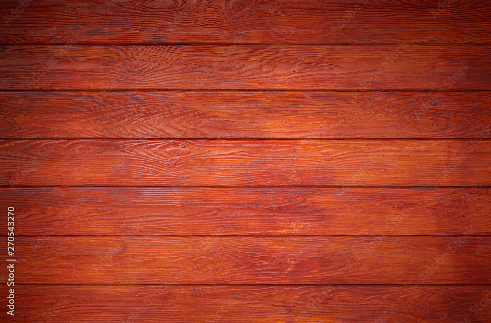 Fototapeta premium Wood paneling wall in reddish brown.