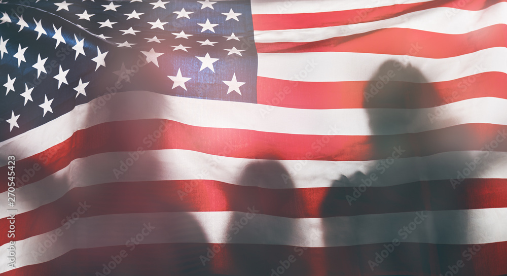 Fototapeta premium People holding the Flag of the USA.