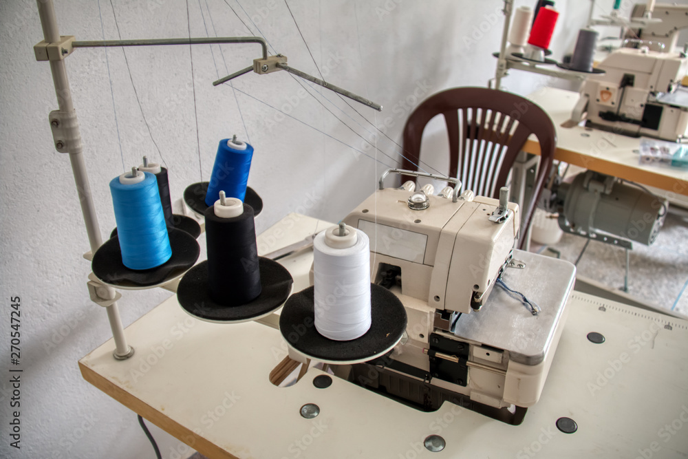 Industrial sewing machine installed in a sewing workshop