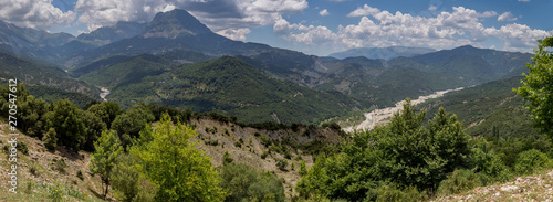 The mountains and the river Kalarrytikos (Greece)on a sunny summer day.