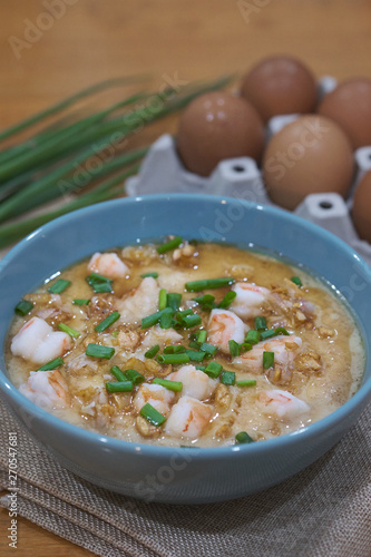Steamed egg custard cuisine in a blue bowl with minced pork, sausage and shrimp. Or Only with egg, water, salt and some sesame oil, you can make this super smooth custard.