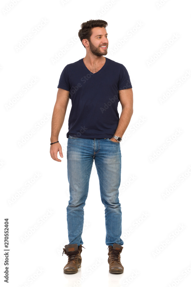 Smiling Handsome Man Is Standing With Hand In Pocket And Looking Away Smiling Handsome Man Is Standing With Hand In Pocket And Looking Away