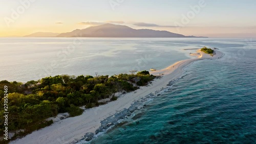 Epic aerial view of tropical island at sunset