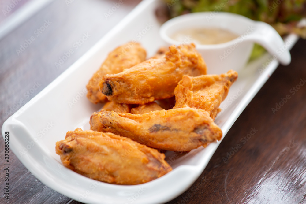 Fried Chicken, Sauce and Organic Vegetables, Beautifully decorated in white plate Fried Chicken, Sauce and Organic Vegetables, Beautifully decorated in white plate