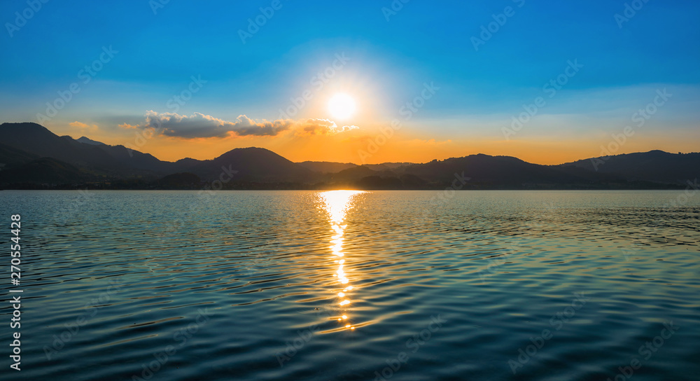Colorful sunset over a mountain lake