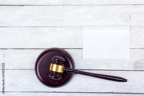 Law concept. Business card. Corporate stationery set mockup. Blank textured brand ID elements on wooden table, gavel. Top view.