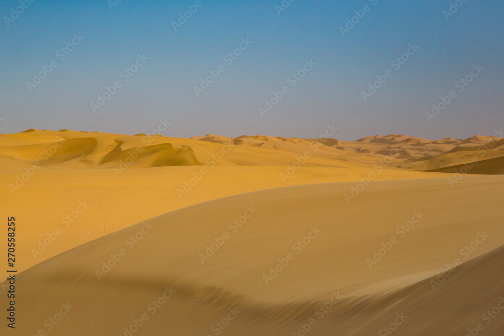 sand dune landscape in Namib desert, blue sky