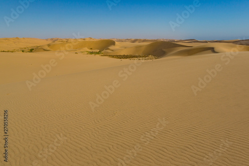 Namib desert with many sand dunes  blue sky