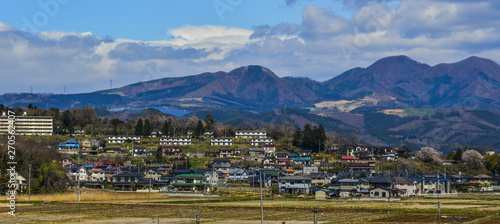 Cityscape with snow mountain in sunny day