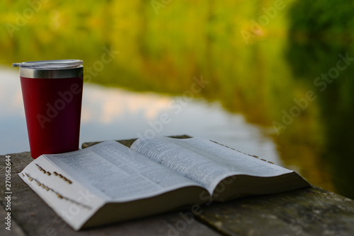 Devotional time outdoors: the Bible and a travel mug