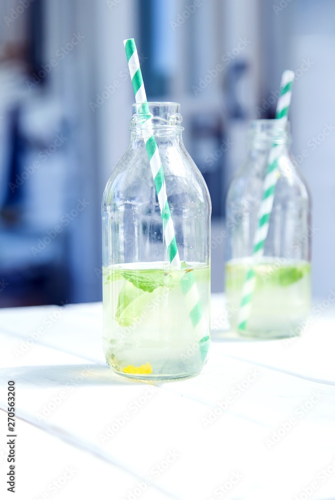 Two bottles with lemonade. Two bottles with lemonade.