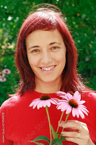 Girl with coneflowers. Echinacea purpurea.