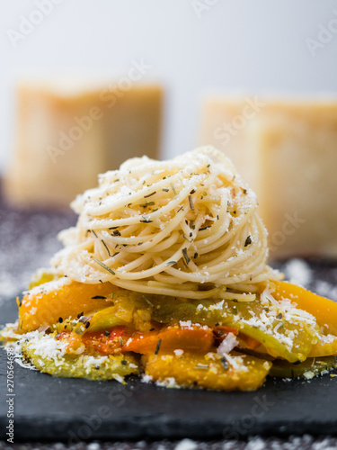 Spaghetti Pasta with vegetables, cheese and herbs.