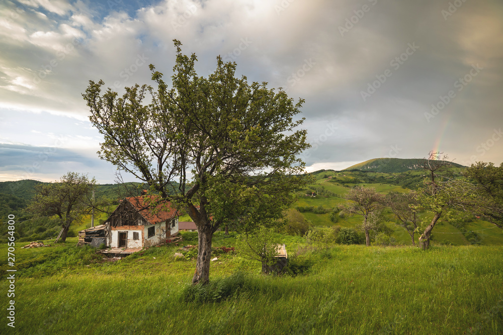 Beautiful summer green hills in Transylvania. Sunrise landscape in the Romanian mountain village