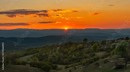 Spring Sunset over green mountains