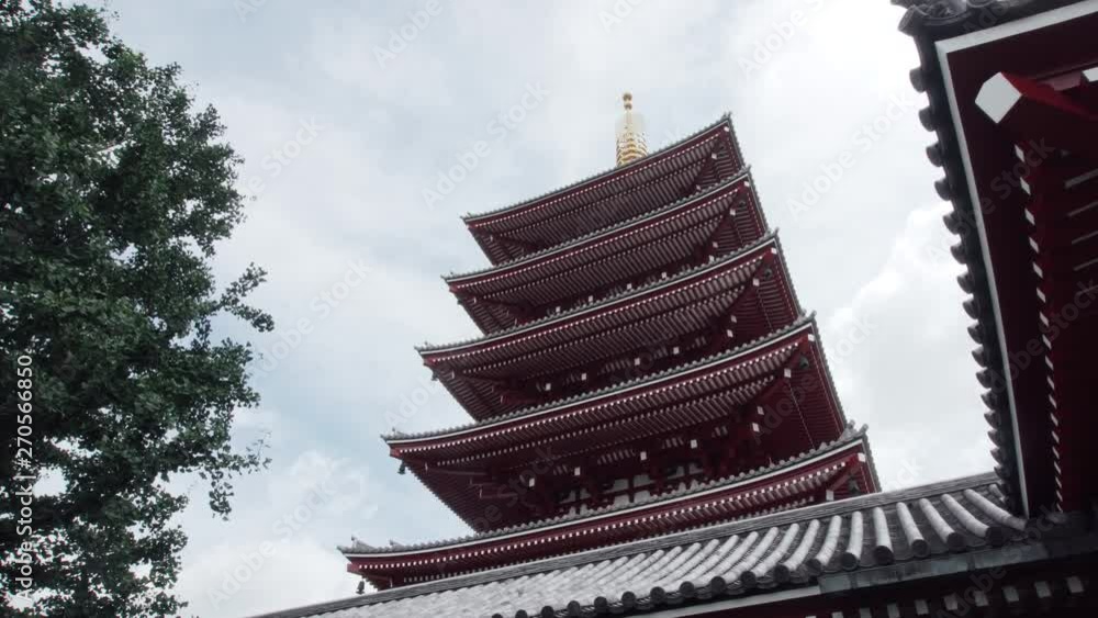 An old high Japanese temple tower reaching to the sky An old high Japanese temple tower reaching to the sky