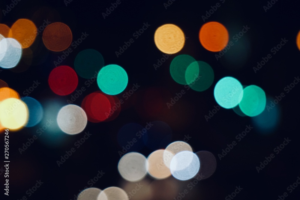 colorful bokeh lights in the street in the city at night colorful bokeh lights in the street in the city at night