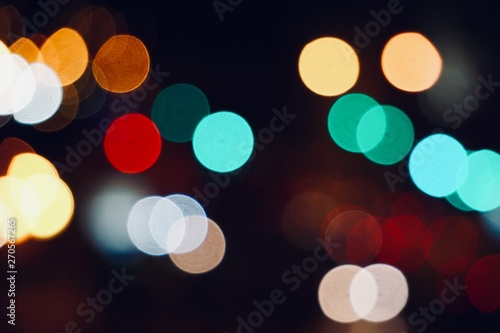 colorful bokeh lights in the street in the city at night