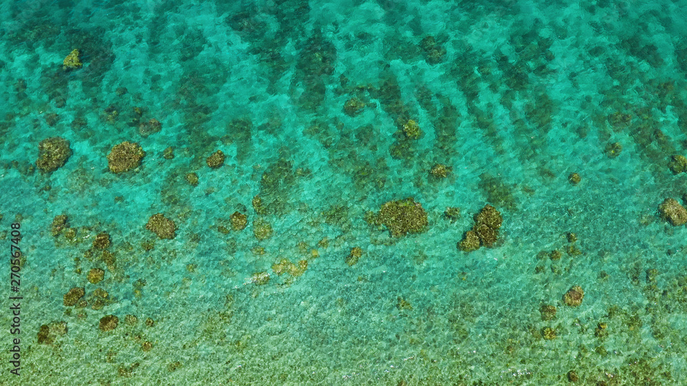 Transparent sea water copy space for text, top view. Aerial view of calm sea water. Top view of a clean ocean water near a coast. Transparent sea water copy space for text, top view. Aerial view of calm sea water. Top view of a clean ocean water near a coast.