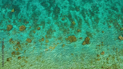 Transparent sea water copy space for text, top view. Aerial view of calm sea water. Top view of a clean ocean water near a coast.