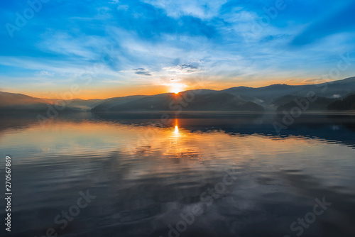 Colorful sunset over a mountain lake