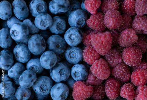 A tasty and healthy snack: raspberries and blueberries.