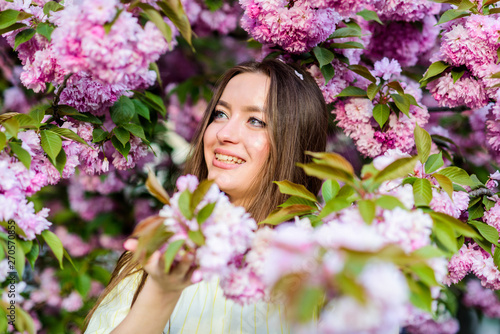 Natural cosmetics for skin. Floral paradise. Girl in cherry blossom flower. Sakura tree blooming. Cosmetics concept. Gorgeous flower and female beauty. Woman in spring flower bloom. Soft and tender