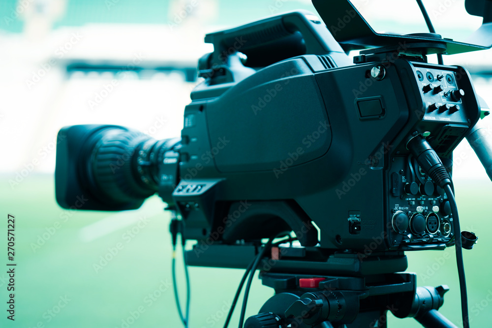 Video camera lens - recording show in TV studio - focus on camera aperture Video camera lens - recording show in TV studio - focus on camera aperture