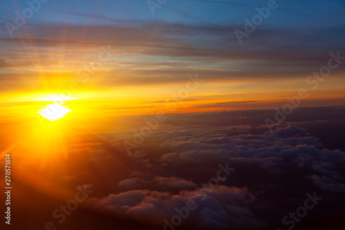 flight in the evening over the clouds