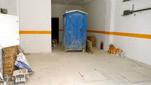 Mobile construction site toilet, dixie closet. Toilet for construction workers in a building © anela47