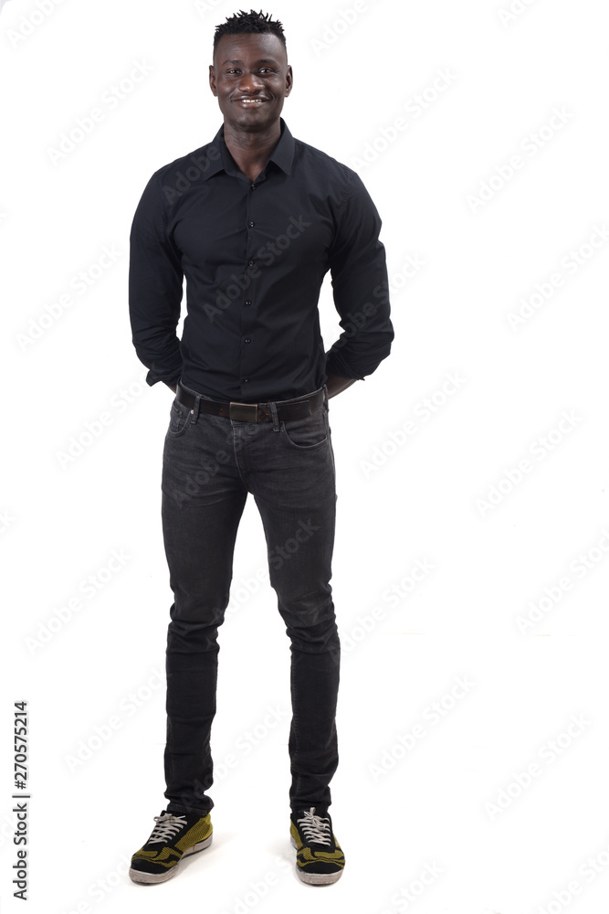 full portrait of an african man with his hands crossed behind full portrait of an african man with his hands crossed behind