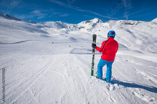 Skier psoing in famous ski resort in Alps, Livigno, Italy, Europe.