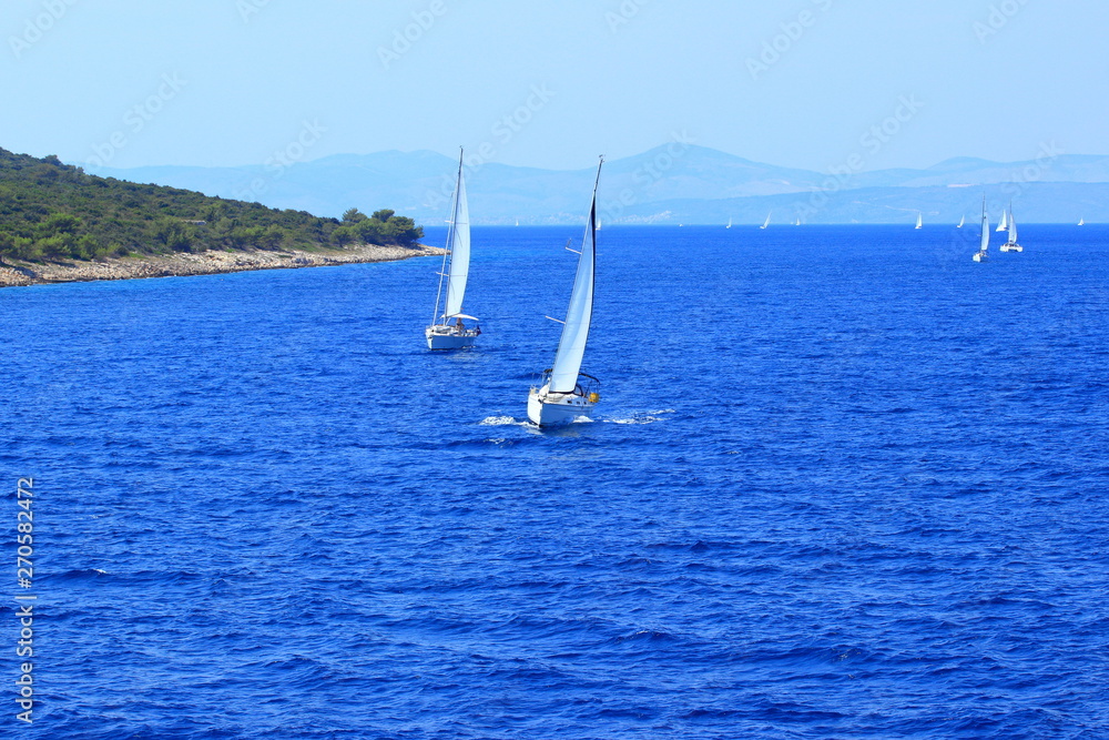 Nautical vessels on Adriatic sea near island Hvar, in Croatia; beautiful sunny day