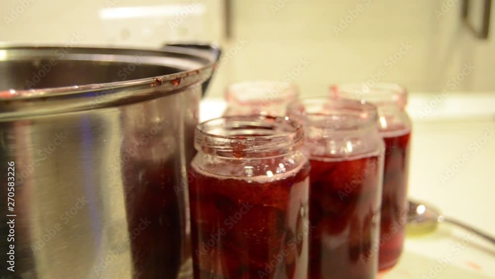 Woman Puts Handmade Strawberry Jam In Jar
