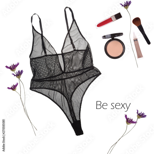 Stylish black sexy lace lingerie with cosmetic products and flowers isolated on white background. Female wardrobe, shopping concept. Top view, flat lay