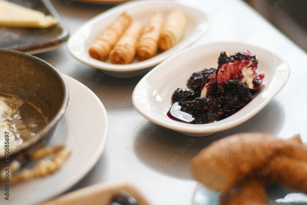 Blackberry jam on a plate with cream Blackberry jam on a plate with cream