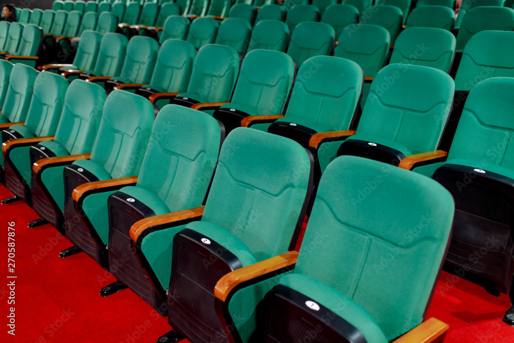 Obraz premium Go green for sitting and watching pictures. Placed in multiple locations in the theater. Taken from the side