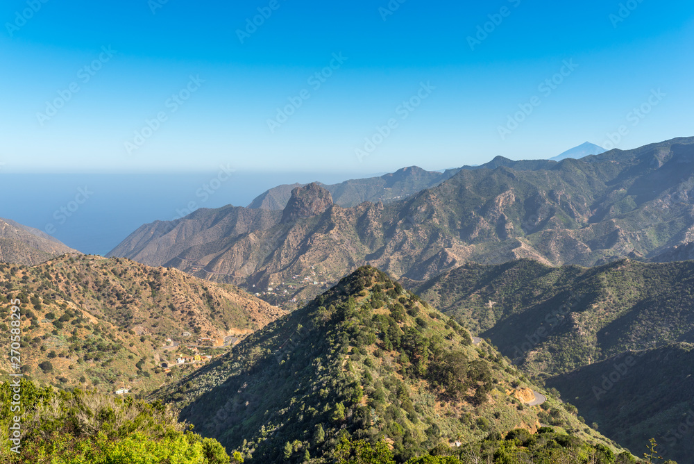 Canyon and jagged mountain range of Vallehermoso what means the beautiful valley in english. View to the Roque Cano, a famous volcanic neck on the north side of La Gomera