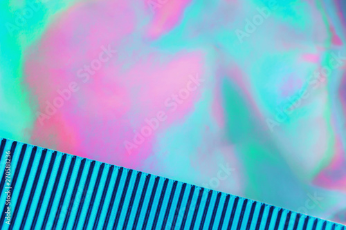 Abstract trendy mint colored holographic background with turquoise metallized corrugated paper. Copy space. Design template.Vaporwave style. Retrowave  retro futurism  webpunk