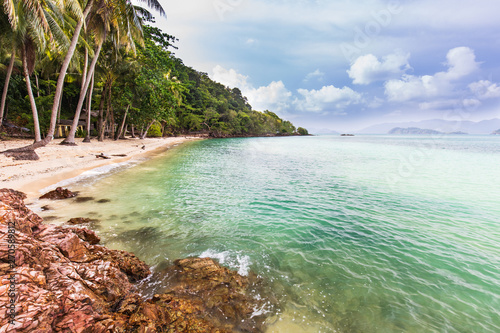 Fototapeta Naklejka Na Ścianę i Meble -  Beautiful rocky on seashore in tropical beach of Koh Wai, Trat province, Thailand.